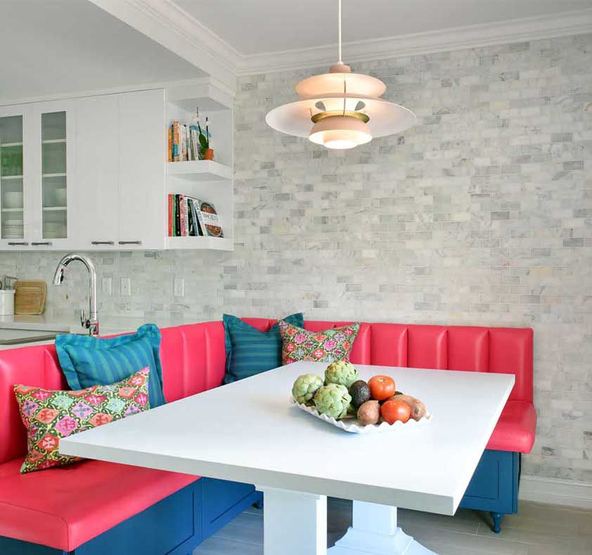Gray kitchen with hot pink and teal banquette