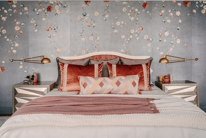 Gray bedroom with lavender and coral accents 