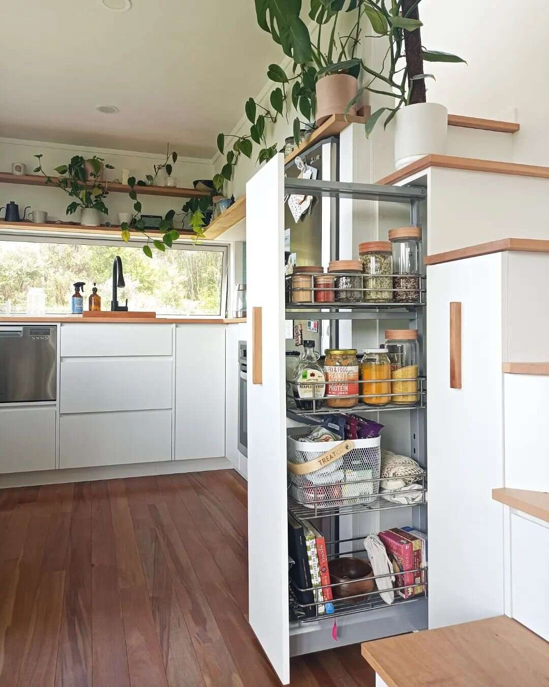 Tiny home storage ideas, pull-out cabinet, kitchen, white cabinets, storage