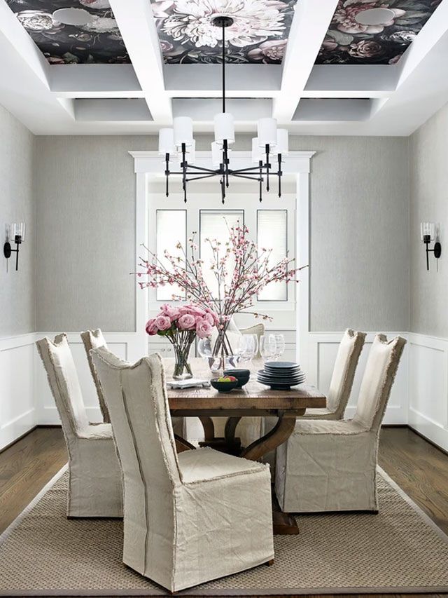 Gray dining room with black floral wallpaper on ceiling