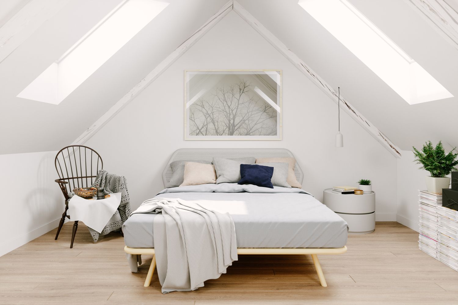 Chambre sous les combles rénovée avec des murs blancs et deux grands velux.