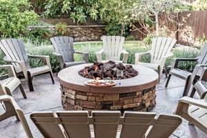 Fire pit surrounded by outdoor chairs