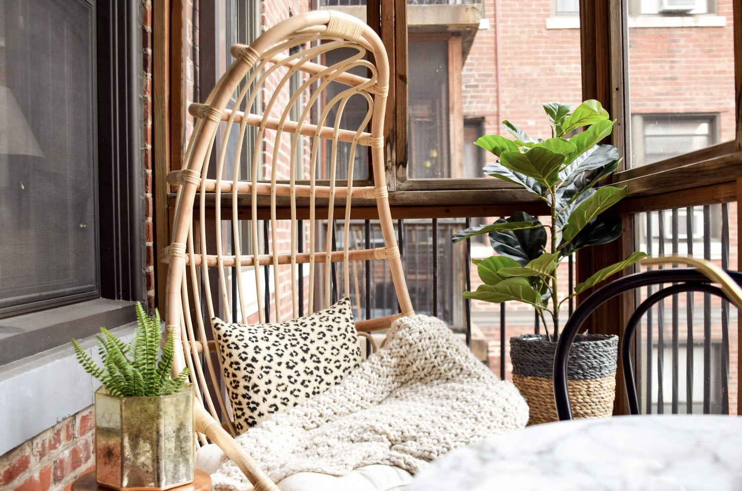 outdoor chair with blanket and plants 