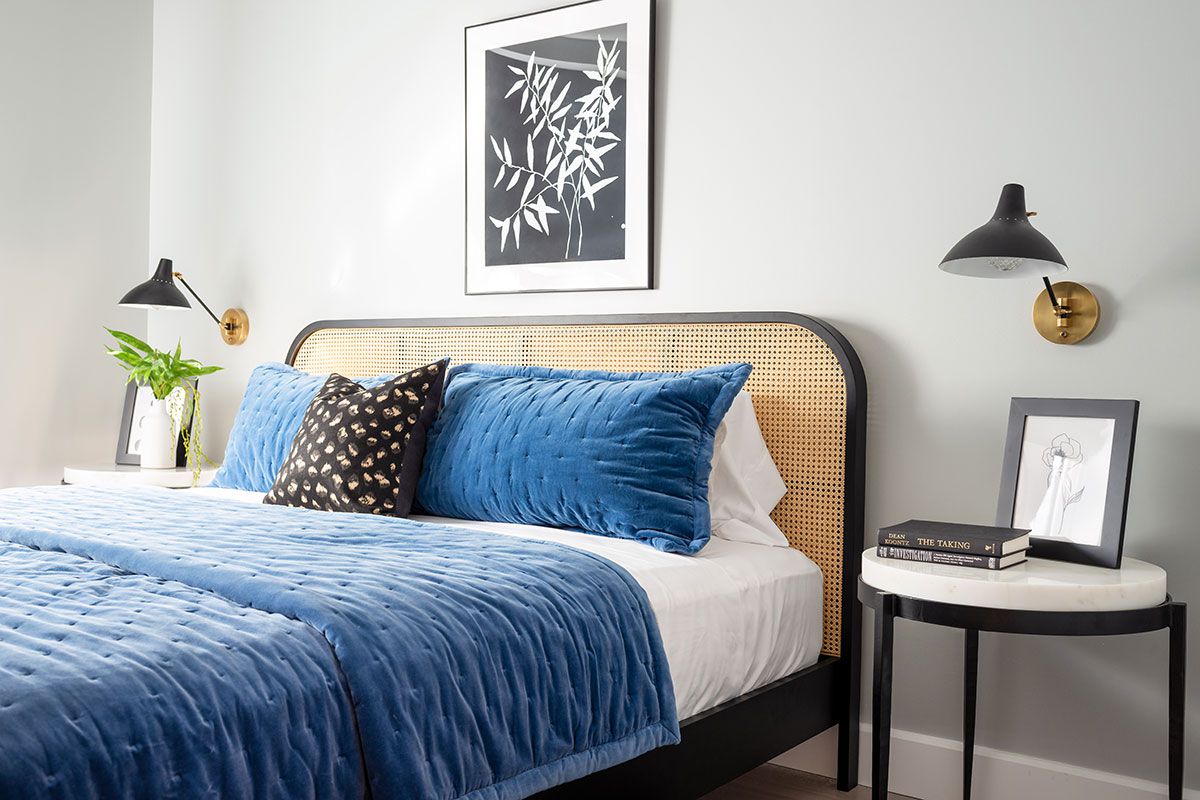 small bedroom with wall sconces