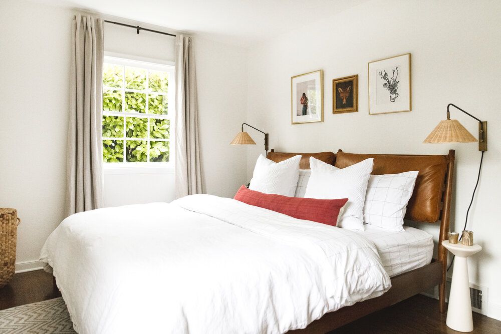 small bedroom with midcentury modern bed frame
