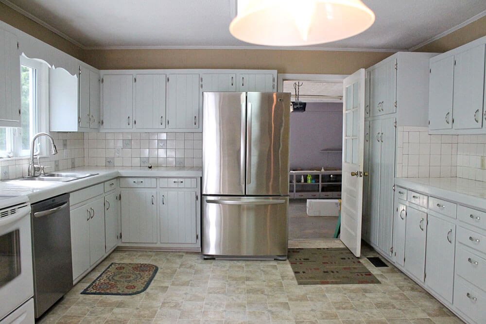 A large kitchen with outdated cabinets