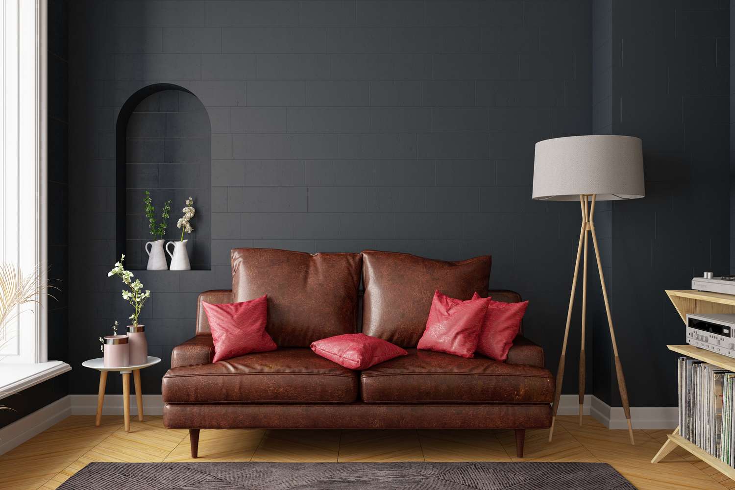 a living room with a black wall and leather sofa